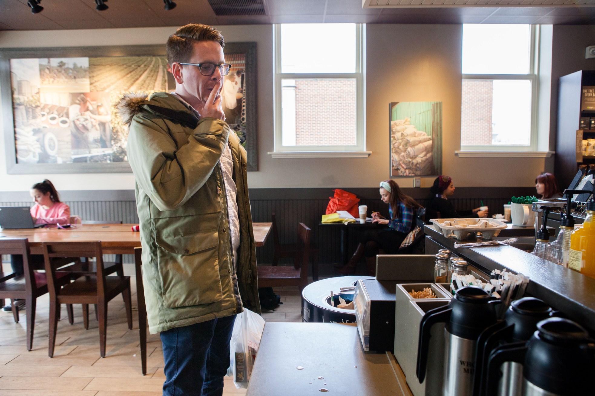 Test cook Sasha Marx looks for sugar-in-the-raw packets at a local coffee shop to use in a last-minute Valentine’s Day recipe.