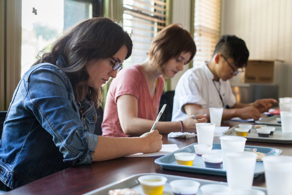 Tasters complete a questionnaire during a tasting to determine if sipping astringent solutions in between samples of fatty food affects the perceived fattiness.