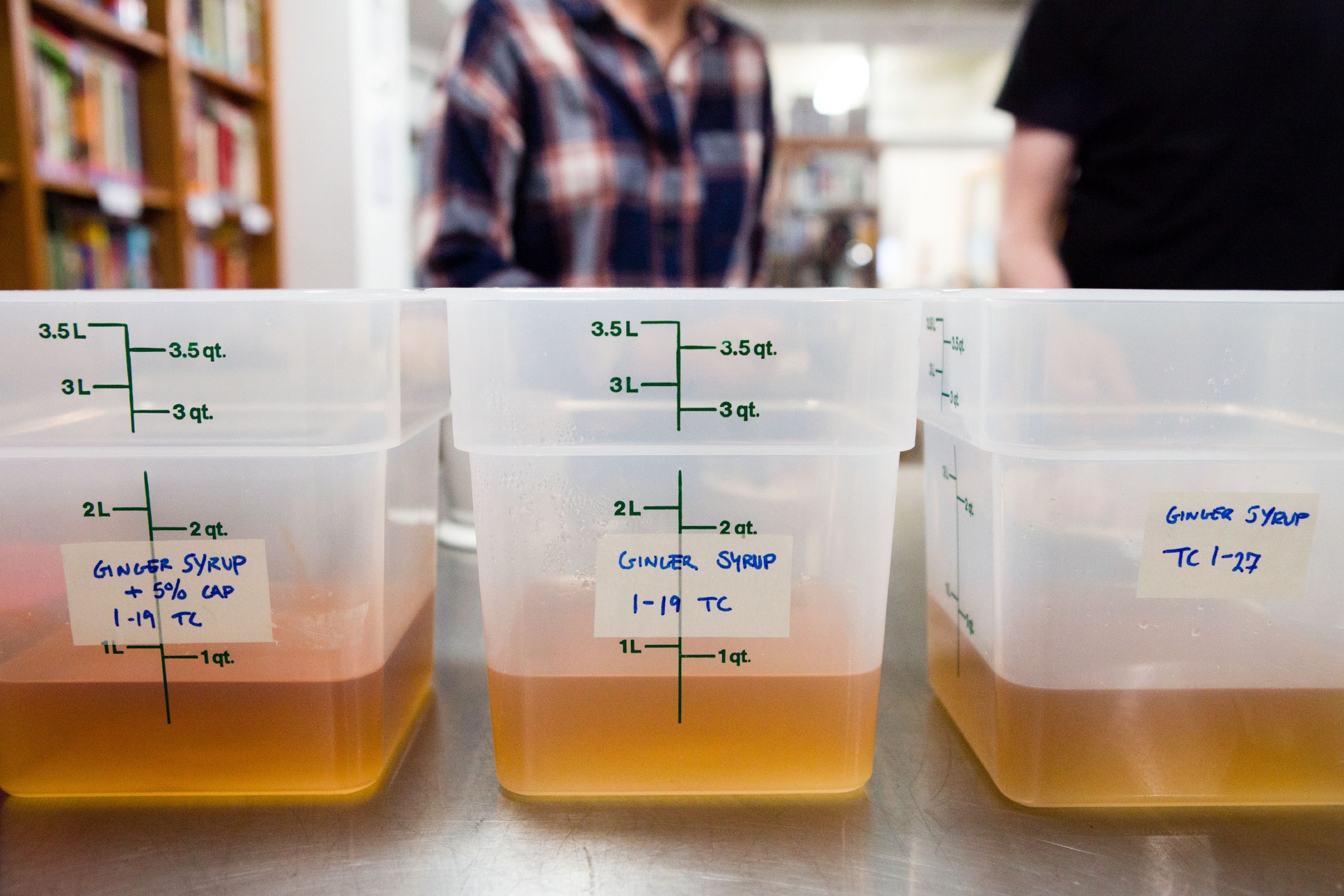 Different formulas of ginger syrup sit ready to taste as associate editor Tim Chin experiments with compounds associated with spiciness for an upcoming article.